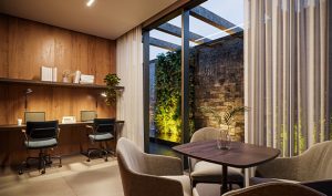 Representa o Coworking do PJM Single Living, é composto por um painel de madeira, cadeiras de escritório e mesa com poltronas em tons de marrons claros. Ainda conta com uma cortina branca e vista para um jardim de inverno